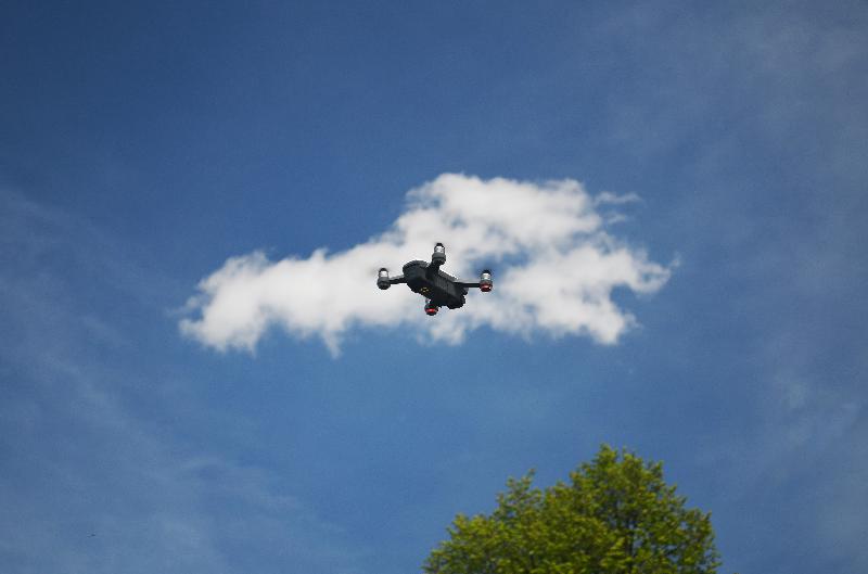 drone in the sky,flying drone,quadrocopter,flying digital camera,drone with built-in camera